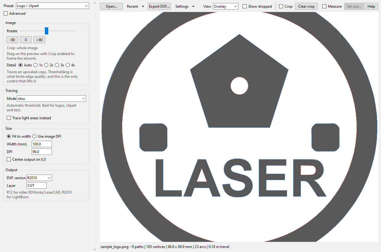 img2dxf tracing a badge logo, settings on the left and the cut paths drawn over the artwork